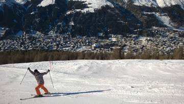 Joel skiing with Davos in the background