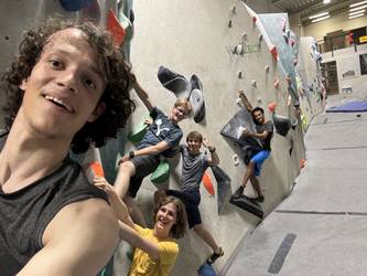 Group selfie on a boulder wall